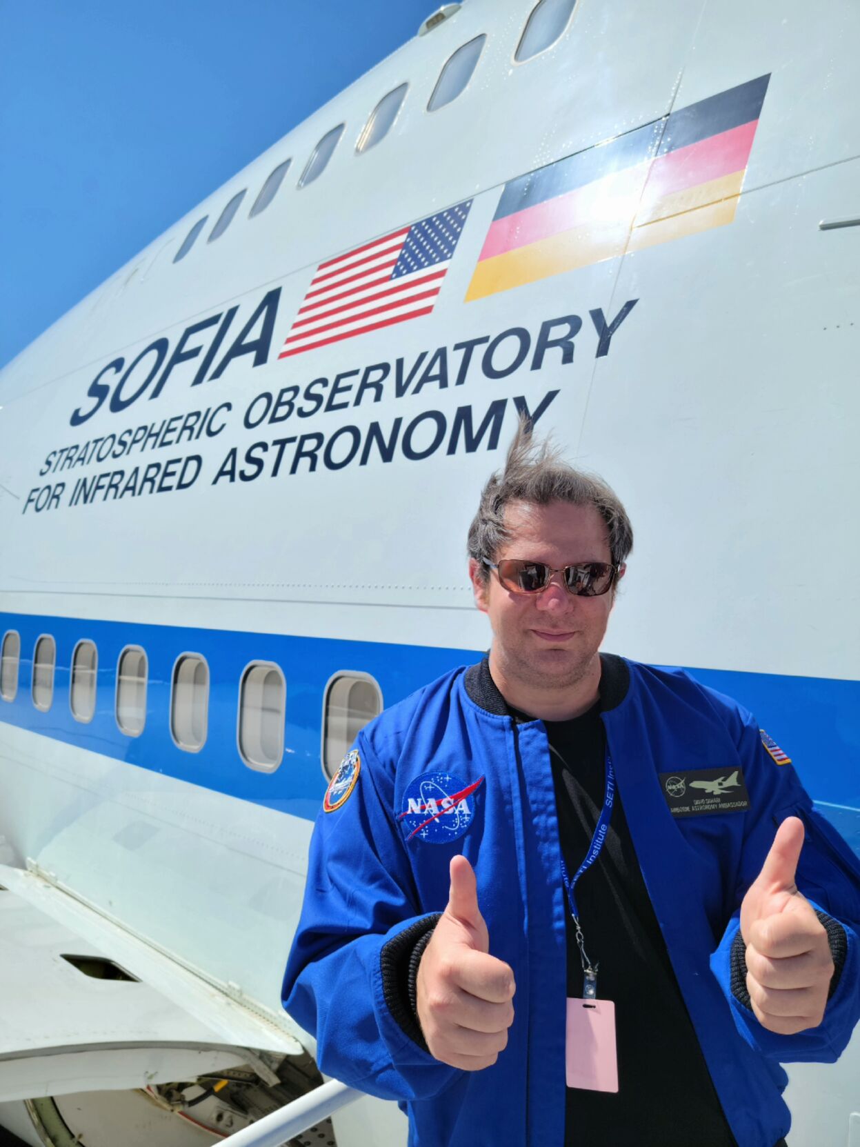 Dahari standing outside SOFIA aircraft